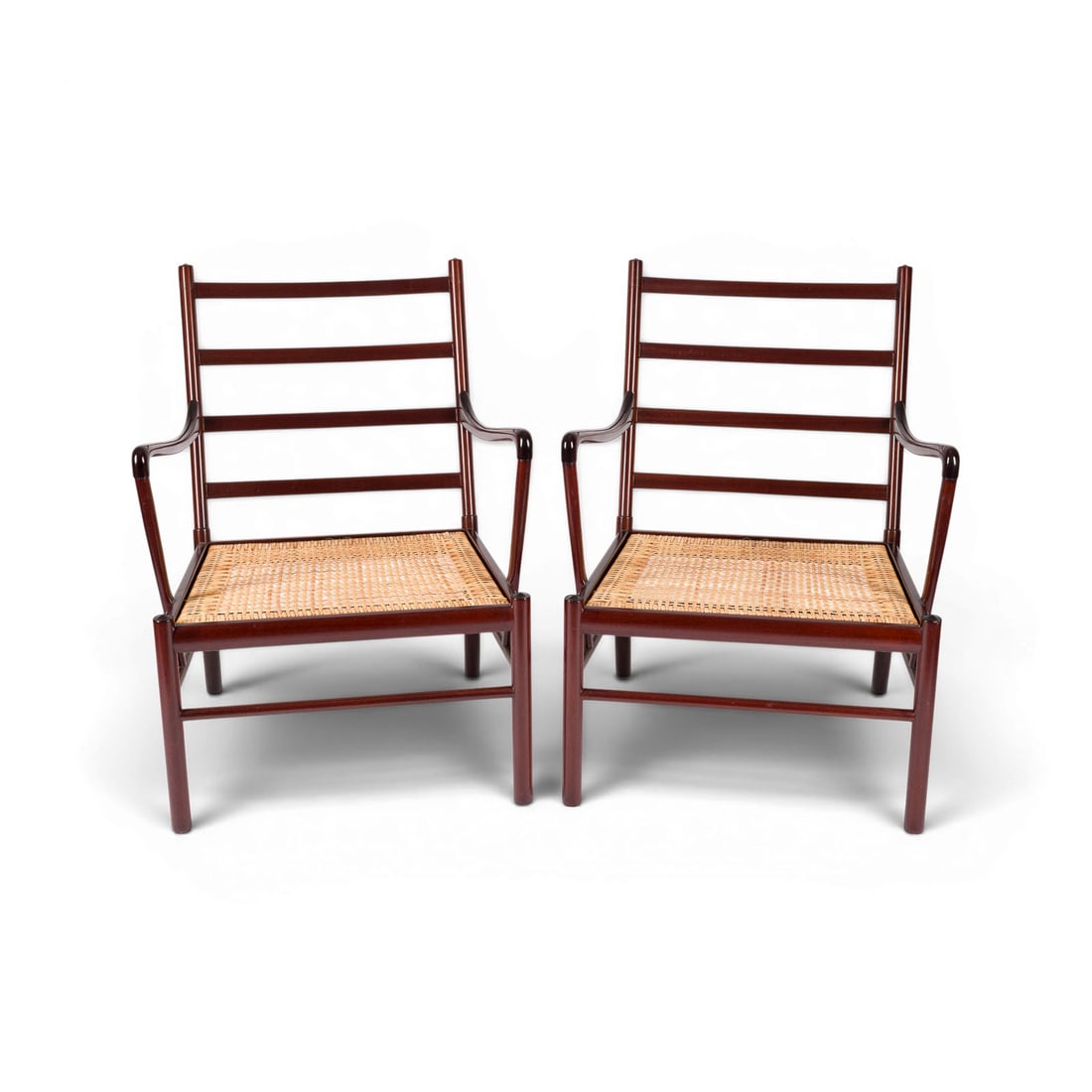 OLE WANSCHER | PAAR 'PJ 149' SESSEL 'COLONIAL CHAIR': OLE WANSCHER 1903 Fredriksberg - 1985 Charlottenlund PAIR OF 'PJ 149' ARMCHAIRS 'COLONIAL CHAIR' Denmark, Poul Jeppesen, designed in 1949 Clear-varnished mahogany, cane, cushions with ochre-coloured l