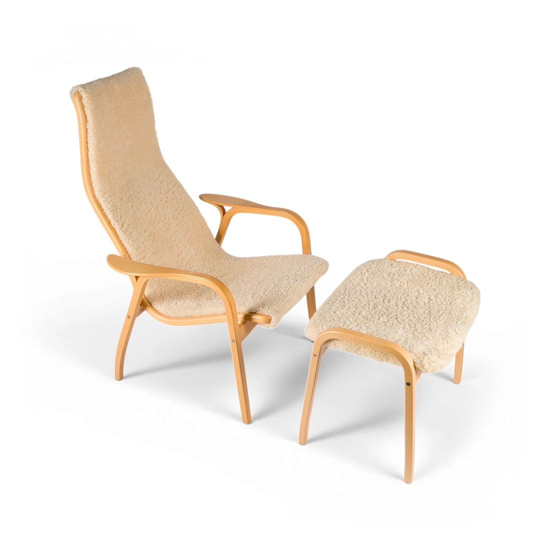 YNGVE EKSTROEM | SESSEL 'LAMINO' MIT HOCKER: YNGVE EKSTROEM 1913 Hagafors - 1988 Vaggeryd, Sweden A 'LAMINO' ARMCHAIR WITH FOOTSTOOL Sweden, Swedese Mobler, designed in 1956, ed. 2007 Laminated beech wood, linen fabric, cream-coloured lambskin. 