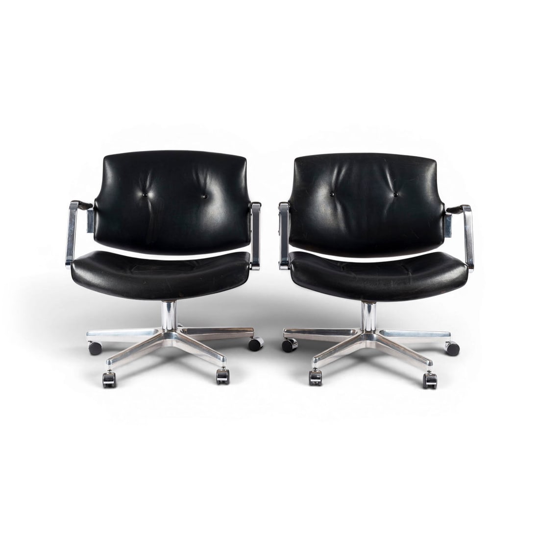 PREBEN FABRICIUS & JOERGEN KASTHOLM | PAAR 'FK 84' ARMLEHNSTUEHLE: PREBEN FABRICIUS & JOERGEN KASTHOLM 1931 - 1984 & 1931 - 2007 PAIR 'FK 84' ARMCHAIRS Kill international, designed in 1962 Chrome-plated metal, black leather, swivelling cast aluminium base with castor