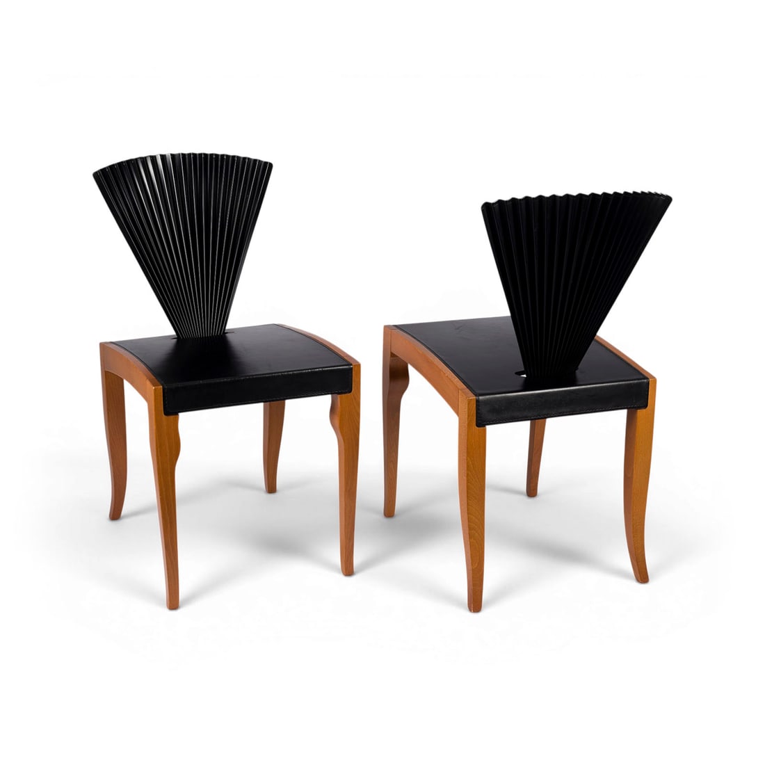 CATTELAN ITALIA | PAAR STUEHLE 'VANESSA': CATTELAN ITALIA Carre / Vicenza PAIR OF 'VANESSA' CHAIRS Cattelan Italia, Design around 1990 Stained wood, lacquered metal, seat with black leather. H. 83 cm, W. 42,5 cm, D. 53 cm. Light traces of use