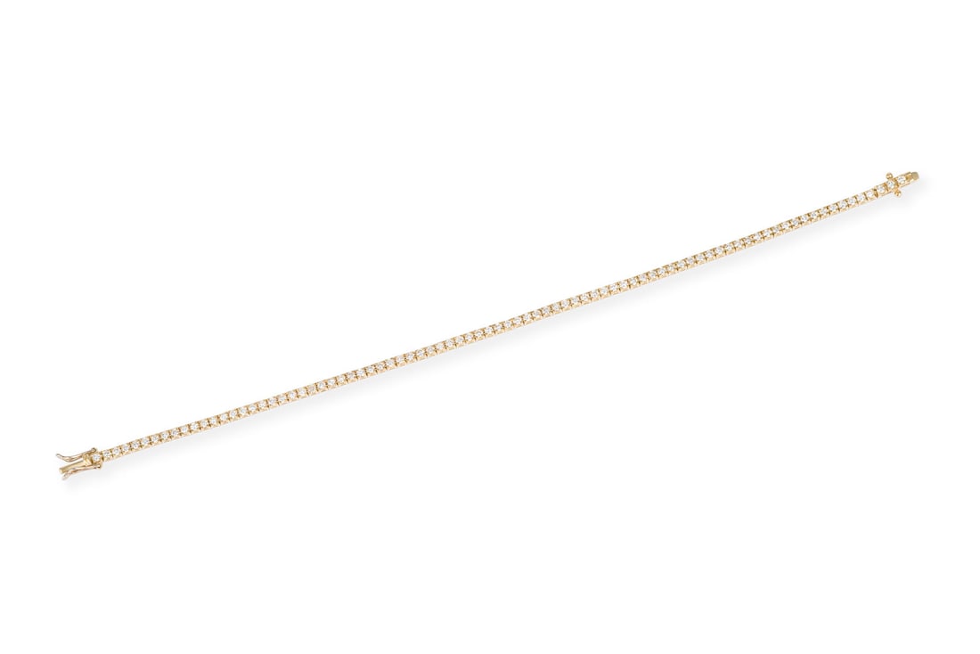TENNIS ARMBAND: TENNIS ARMBAND GG 750. L.: ca. 19,0 cm. B.: ca. 2,2 mm. Ges.-Gew.: ca. 7,6 g. Tennisarmband, besetzt mit Brillanten zus. ca. 2.20 ct. H/VVS-VS. Kastenschloss mit doppelter Sicherheitsacht.