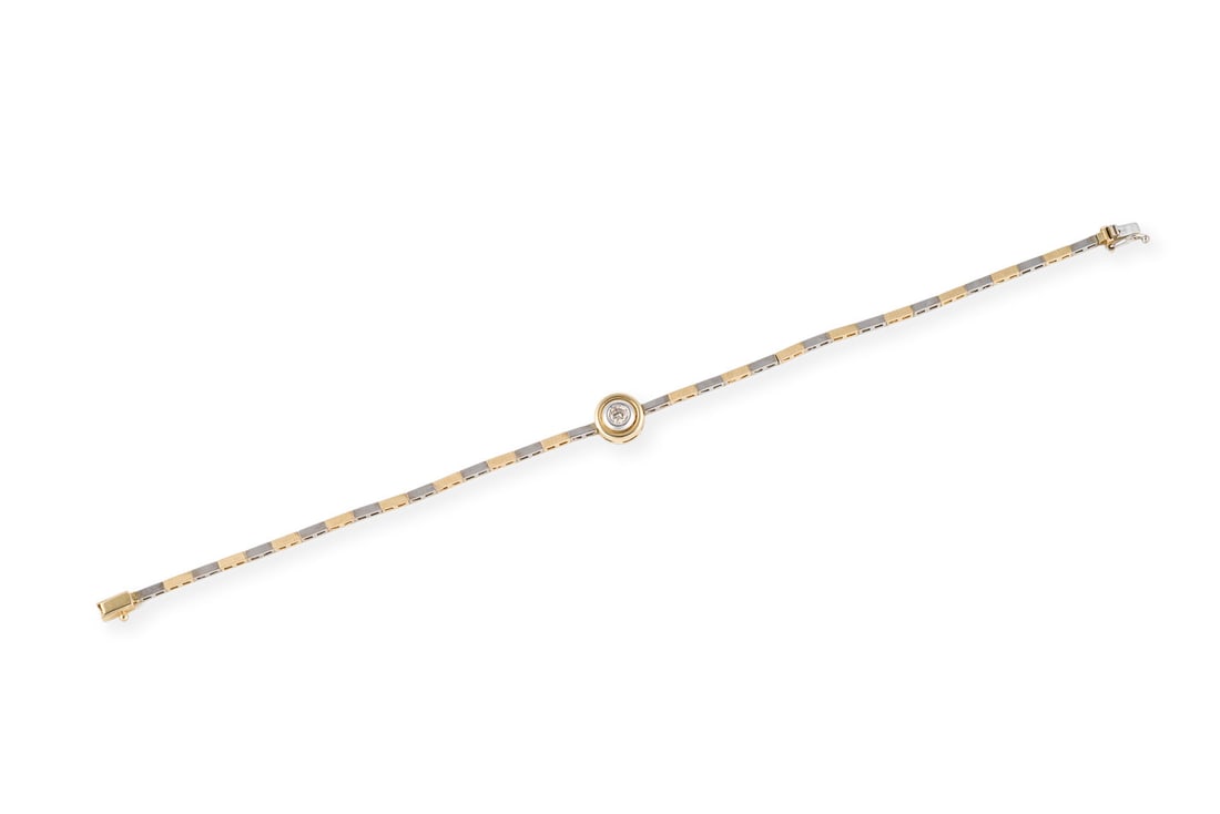 BICOLOR BRILLANT ARMBAND: BICOLOR BRILLANT ARMBAND WG/GG 585. L.: ca. 19,0 cm.. Ges.-Gew.: ca. 6,5 g. Armband, besetzt mit einem Brillanten von ca. 0.15 ct. J/P. Kastenschloss mit Sicherheitsacht.