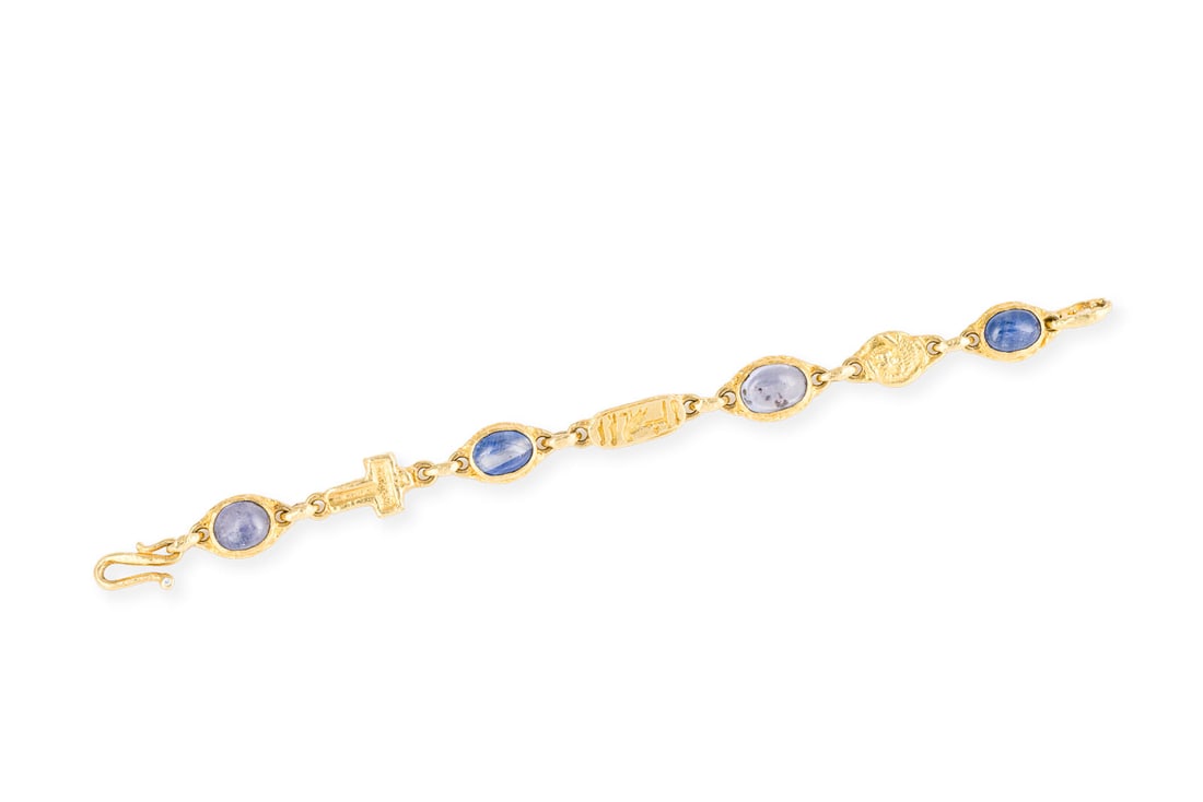 SAPHIR CABOCHON ARMBAND: SAPHIR CABOCHON ARMBAND GG 750. L.: ca. 19,0 cm. Ges.-Gew.: ca. 34,7 g. Armband, besetzt mit Saphir-Cabochons zus. 16.50 ct. S-Haken-Verschluss.