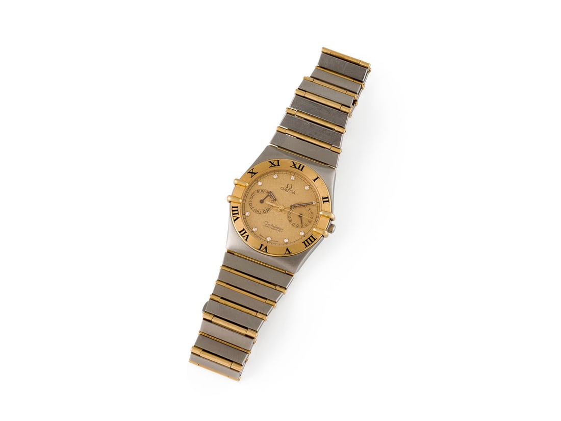 'OMEGA' CONSTELLATION ARMBANDUHR: OMEGA' CONSTELLATION ARMBANDUHR Referenznummer: 1448/431. Quarz (Nicht auf Funktion geprueft). Edelstahl, GG. Gehaeuse D. ca. 34,0 mm; Armband L. ca. 19 cm. Ges.-Gew.: ca. 76,7 g. Mit Original-Box.