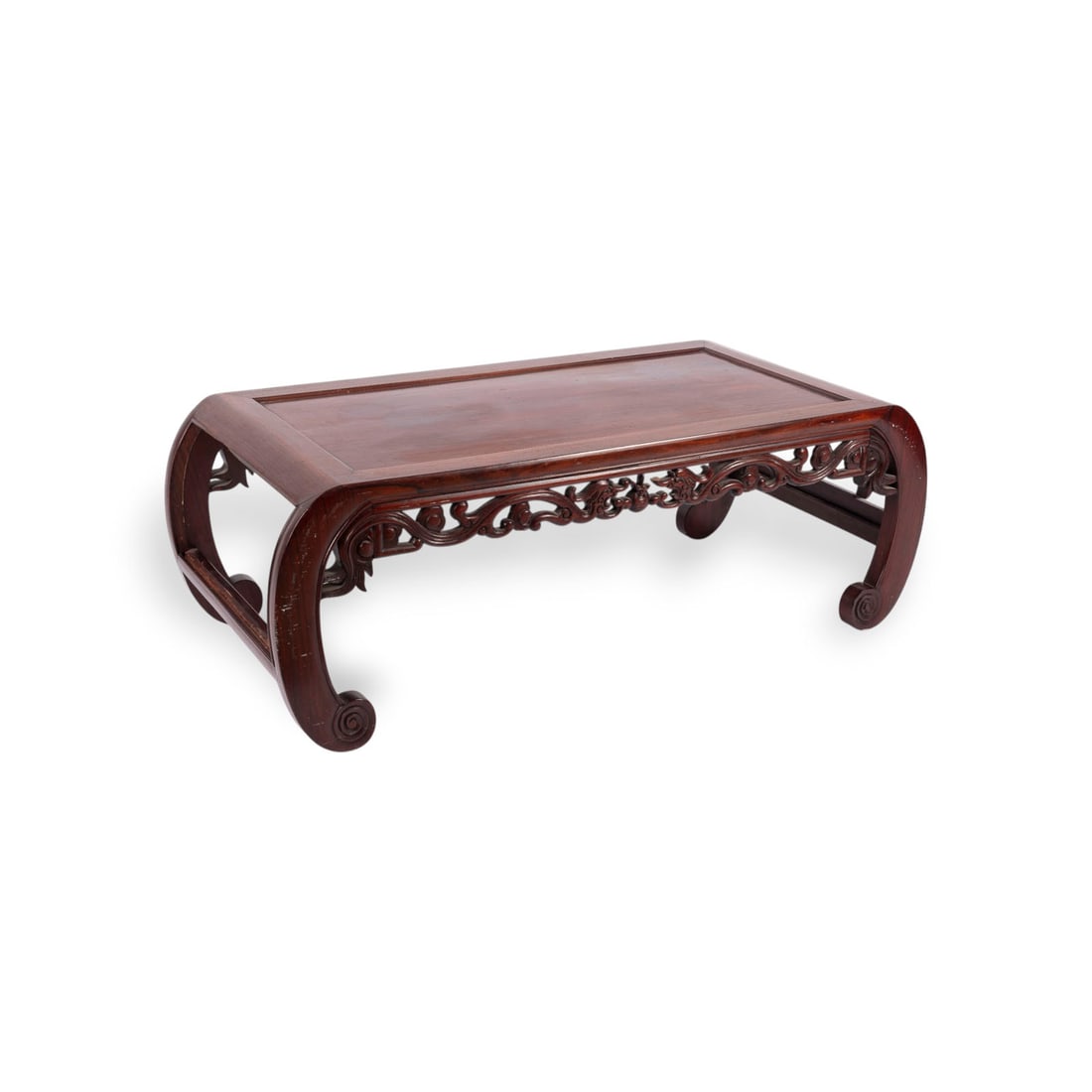 EIN KANG-TISCH AUS HARTHOLZ: A HARDWOOD KANG TABLE China, 19th/20th century Wood. H. 34 cm, L. 97 cm. The table is decorated with chi-dragons. With traces of age and use, partially stained and abraded.EIN KANG-TISCH AUS HARTHOLZ 