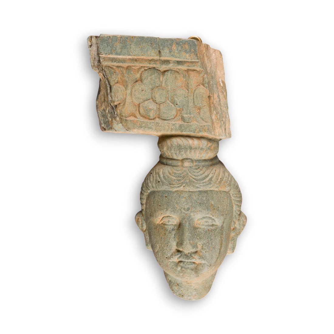 EIN RELIEFFRAGMENT MIT DARSTELLUNG DES BUDDHA AUS GRUENLICHEM SCHIEFER: A GREENISH SCHIST RELIEF FRAGMENT OF BUDDHA Gandhara Schist. H. 12.5 cm. With traces of age, partially damaged and cracked. Provenance: From a German private collection.EIN RELIEFFRAGMENT MIT DARSTELL