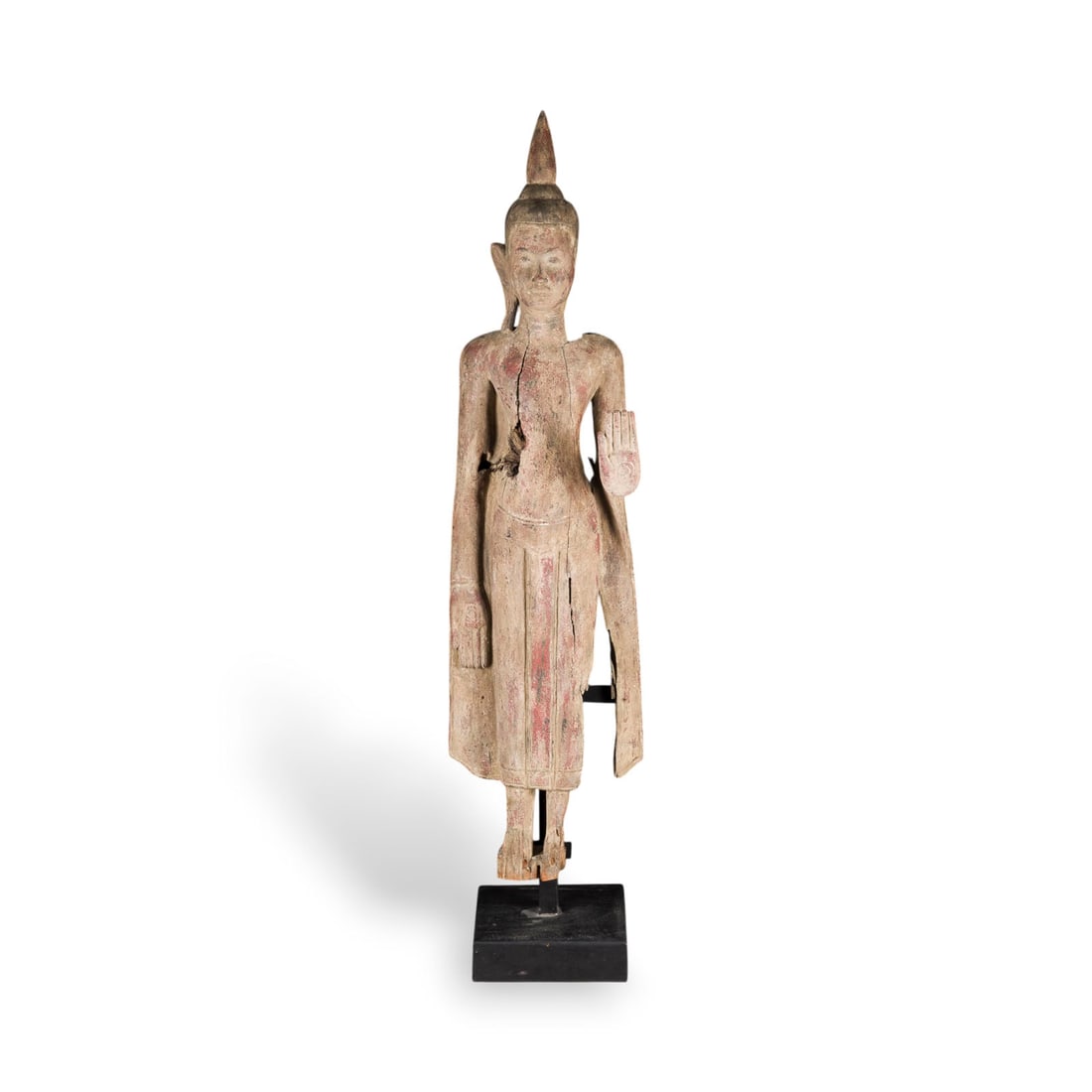 EINE BEMALTE HOLZFIGUR DES BUDDHA: A PAINTED WOOD FIGURE OF BUDDHA Thailand/Laos Wood. H. 112 cm (incl. base). The Buddha is shown standing with his left hand raised in abhaya mudra and his right at his side. With traces of age,