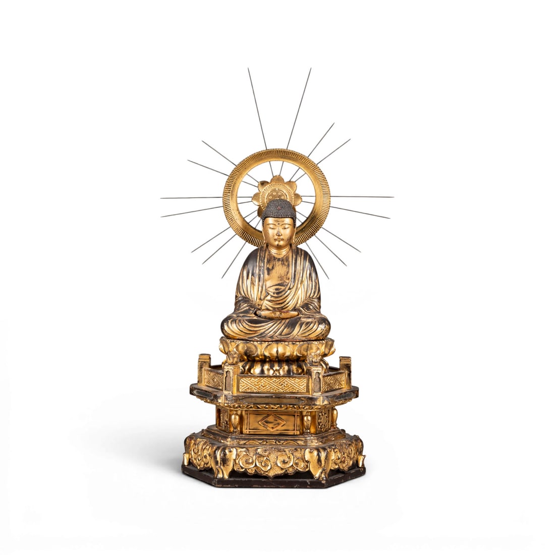 EINE VERGOLDETE LACKHOLZFIGUR DES AMIDA NYORAI: A GILT-LACQUERED WOOD FIGURE OF AMIDA NYORAI Japan, Edo period Wood. H. ca. 63 cm. Amida is seated in dhyanasana atop a multi-tiered circular base, with his hands resting in mida no jouin (dhyana