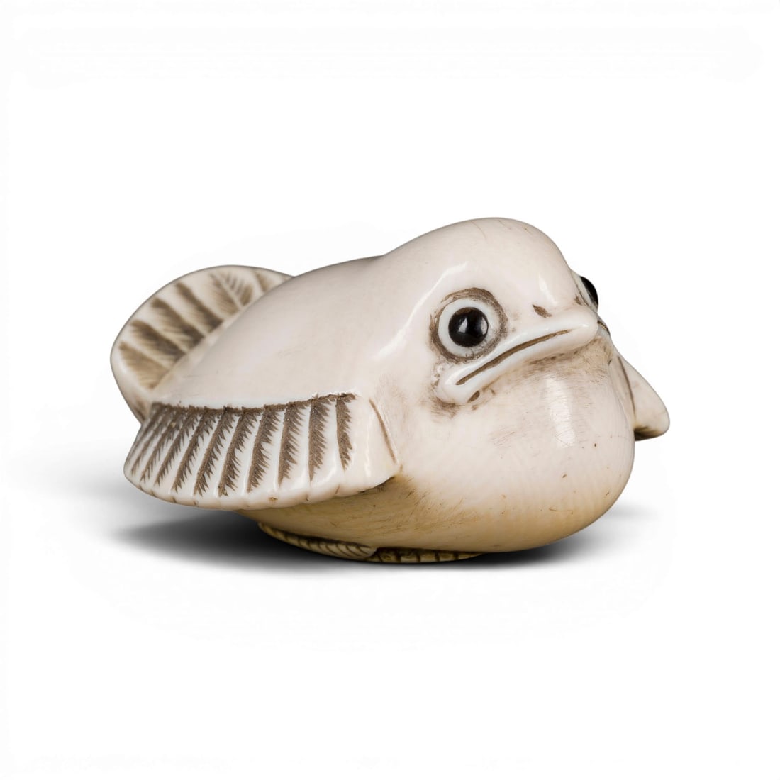 EIN NETSUKE EINES FUKURA SUZUME AUS ELFENBEIN*: AN IVORY NETSUKE OF A FUKURA SUZUME* Japan Ivory. H. 2.7 cm. With traces of use, partially abraded and cracked. CITES marketing certificate is available. Please note that due to the current CITES regu
