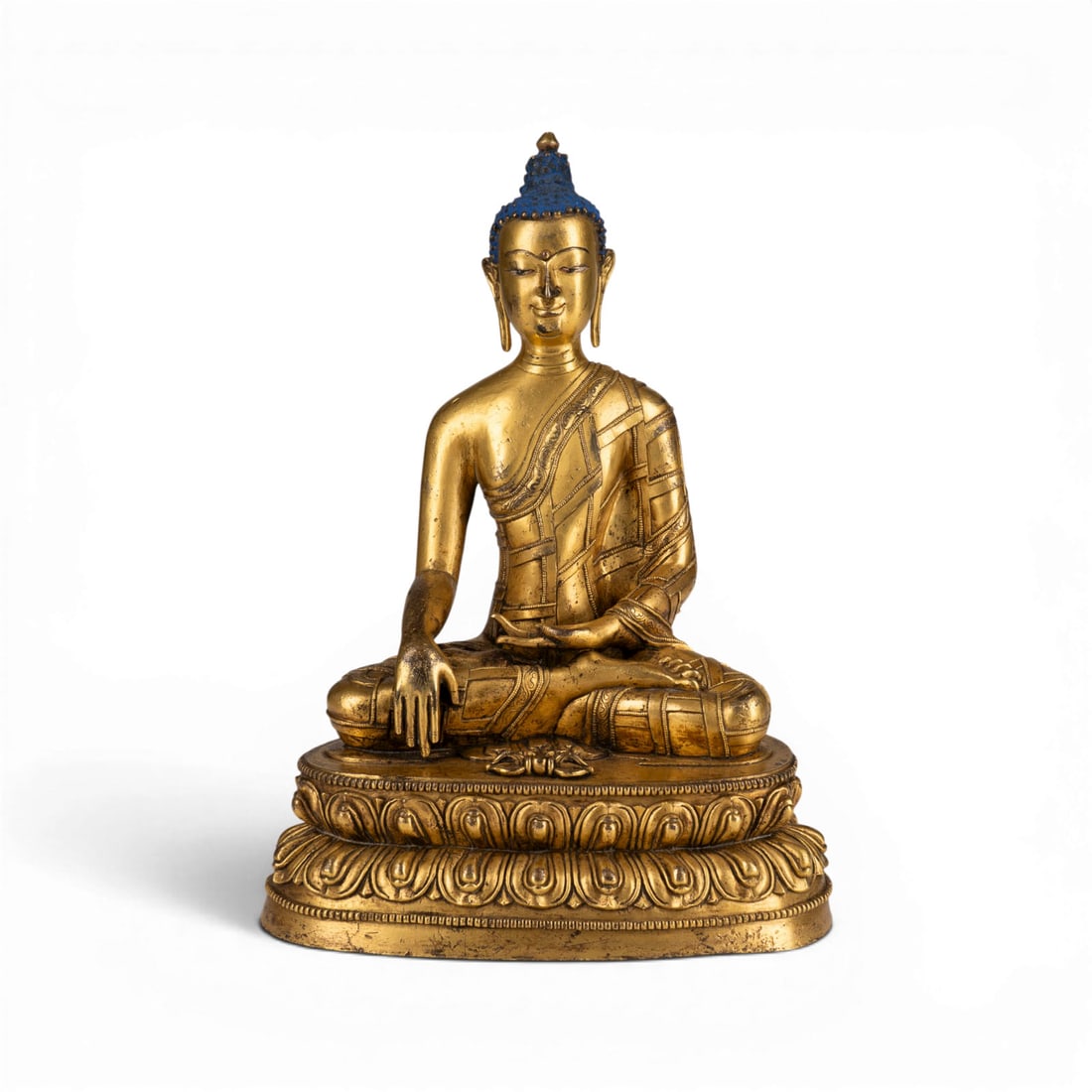EINE VERGOLDETE BRONZEFIGUR DES BUDDHA AKSOBHYA: A GILT-BRONZE FIGURE OF BUDDHA AKSOBHYA Nepal, 19th/20th century Bronze. H. 27.4 cm. With traces of age, partially abraded.EINE VERGOLDETE BRONZEFIGUR DES BUDDHA AKSOBHYA Nepal, 19./20. Jahrhundert