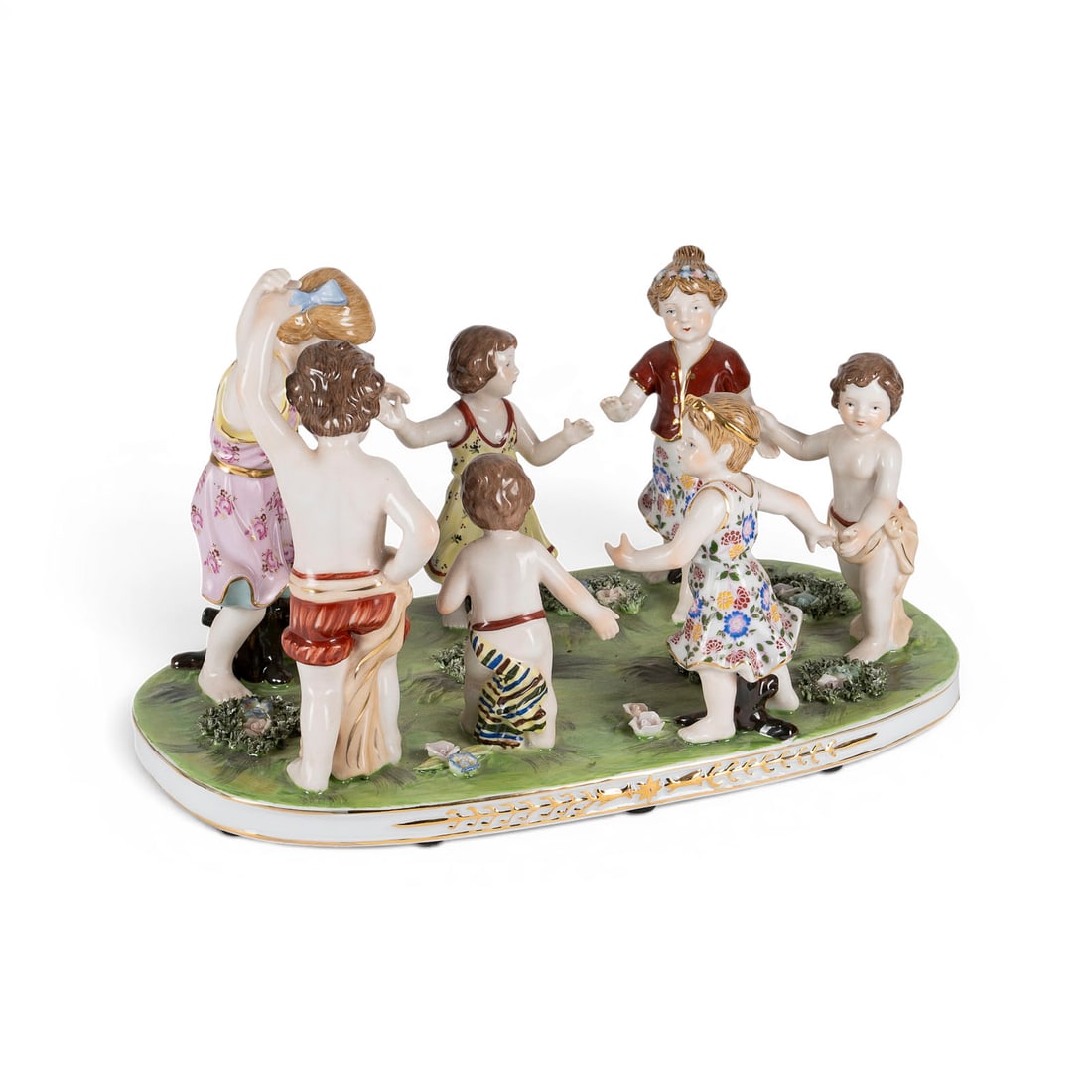 | FIGURENGRUPPE 'KINDERREIGEN': FIGURENGRUPPE 'KINDERREIGEN' Deutsch, Neundorf, 20. Jh. Porzellan, polychrome Malerei, Goldstaffage. H. 23 cm, L. 36,5 cm. Aufglasur-Manufakturstempel. Gebrauchsspuren.FIGURENGRUPPE 'KINDERREIGEN'