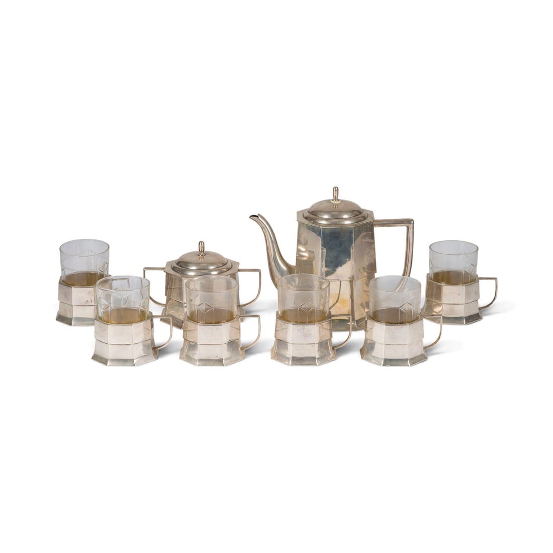 | ACHTTEILIGES TEESERVICE: ACHTTEILIGES TEESERVICE Tschechoslowakei, 1921 - 1929 800er Silber, Glas. Ges.-Gew. 2163 g, H. 18 cm (Teekanne). Punziert mit Fraunekopf-Marke '3' und Meistermarke 'E.K'. Bestehend aus: 1 Teekanne, 1