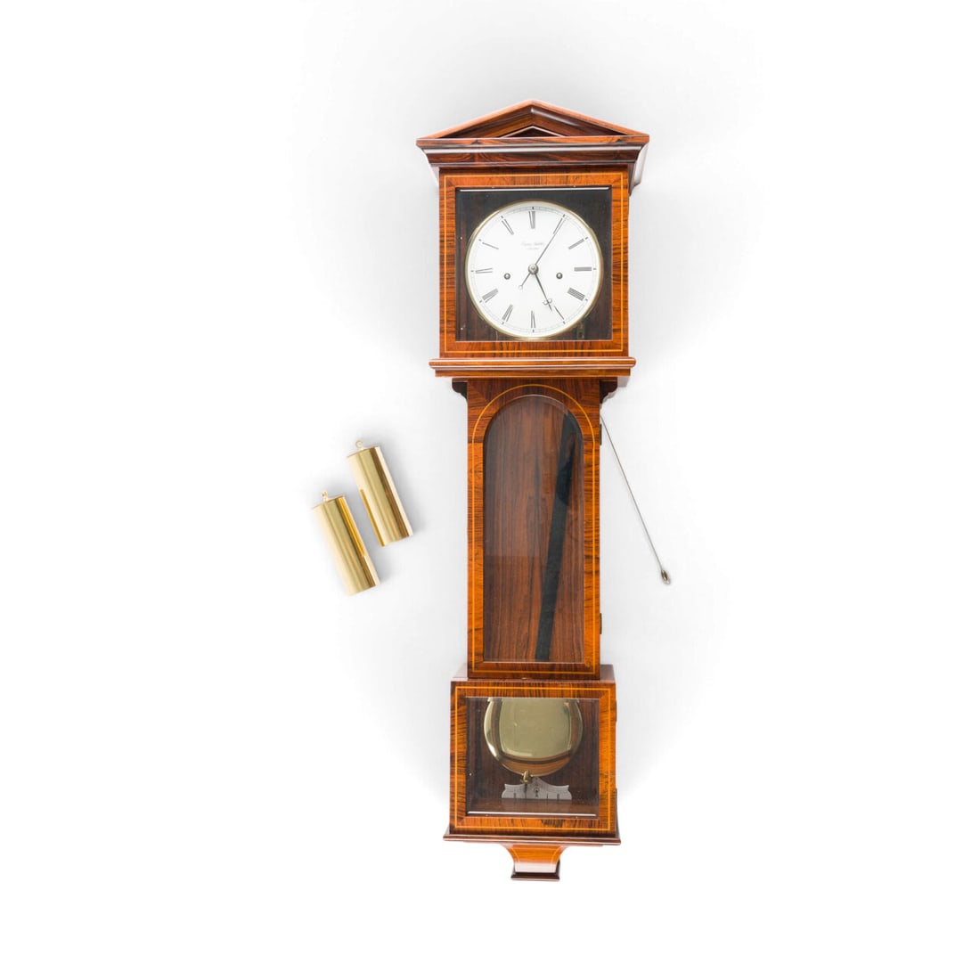 | ERWIN SATTLER REGULATOR IM STIL EINER WIENER DACHLUHR: ERWIN SATTLER REGULATOR IN THE STYLE OF A VIENNA ROOF CLOCK German, Munich, Erwin Sattler, late 20th century Mahogany, veneered, cherry, glass, metal, enamel, steel. 73 x 21 x 12 cm. Inscribed on the 
