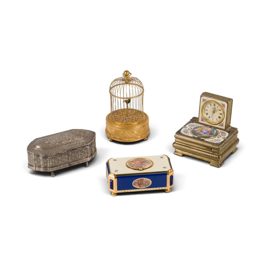 | VIER SPIELDOSEN: FOUR MUSIC BOXES Among others Swiss, 20th century. Metal (partially enameled, partially gilded), plastic, feathers, glass. 5 x 12 x 6.5 cm / 10.5 x 10.5 x 9 cm / 6 x 14 x 7 cm / 15 x 9 x 9 cm. Partial