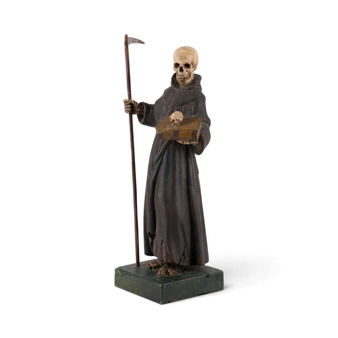 | MEMENTO MORI: MEMENTO MORI Southern German, probably 18th century Carved wood, polychrome-painted, metal. Height 32 cm; plinth 10 x 10 cm. The Grim Reaper, draped in a monastic habit, stands upon a square plinth; h