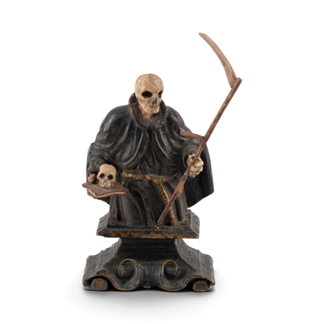 | MEMENTO MORI: MEMENTO MORI Southern German, probably 18th century. Carved wood, polychrome-painted. 16 x 9.5 x 6 cm. Mounted on a volute base, a half-figure of the Grim Reaper in a monastic habit holding a book and