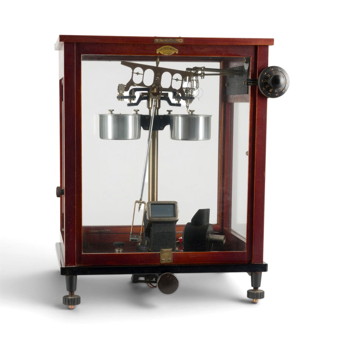 | APOTHEKERWAAGE: APOTHECARY'S SCALE 20th century Wood, glass, metal, steel. 48 x 42 x 29 cm. Marked on a plaque: ''Labor- und Industriebedarf Moeller Weidenau/Sieg''. Signs of use; functionality untested.APOTHEKERWAAG
