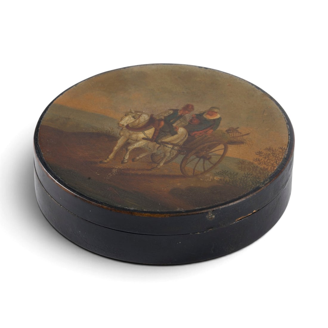 | SCHNUPFTABAKDOSE: SNUFF BOX German, in the style of Stobwasser, first half of the 19th century Papier-mache, black lacquered, polychrome oil and lacquer painting. 10 x 10 x 2.5 cm. Round shape. On the lid, a polychrome