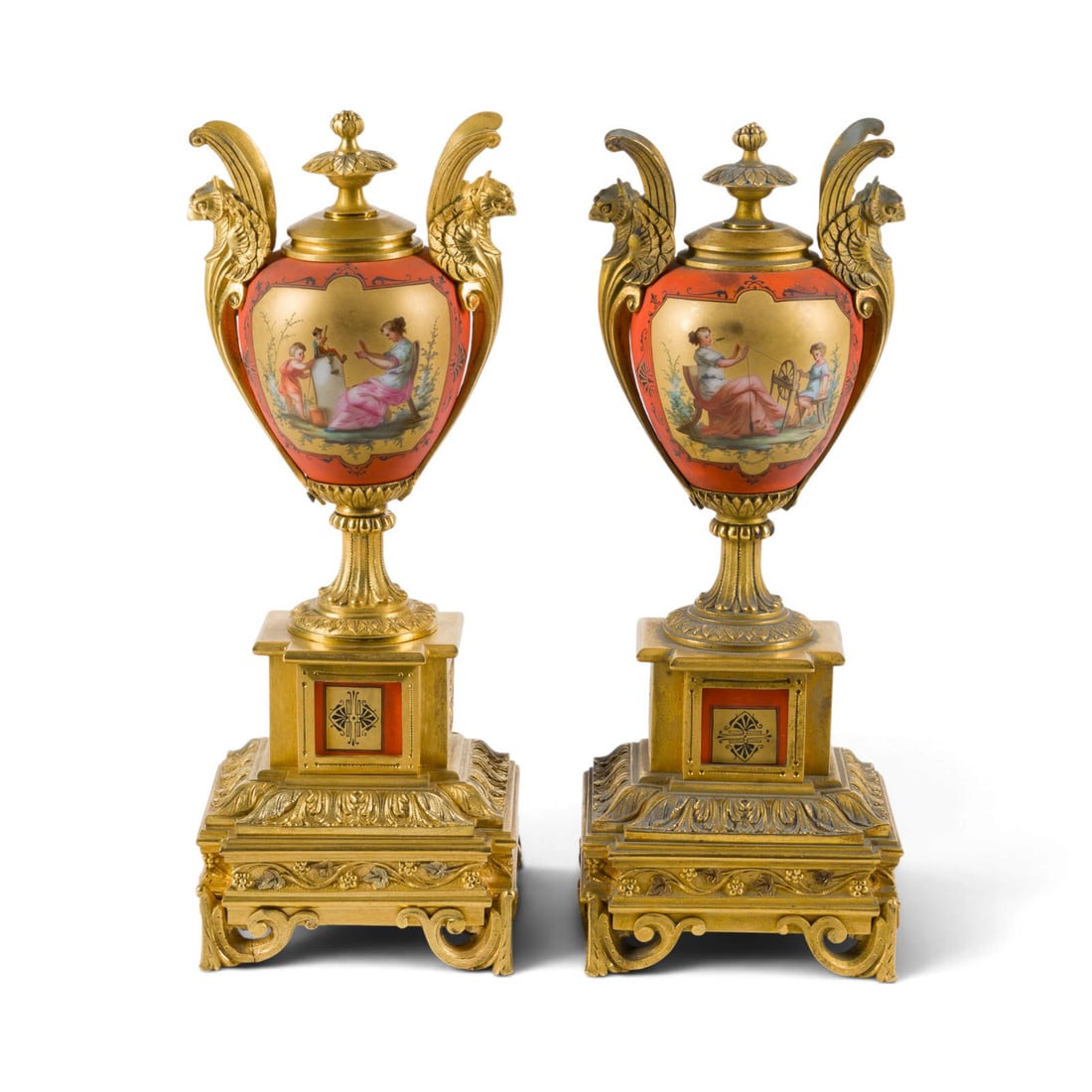 | PAAR NAPOLEON III BEISTELLER MIT GEFLUeGELTEN GREIFEN: PAIR OF NAPOLEON III SIDE STANDS WITH WINGED GRIFFINS France, circa 1860 Gilt bronze, polychrome-painted porcelain. 26.5 x 10.5 x 10.5 cm. Some rubbing, minor chips, and discoloration.PAAR NAPOLEON