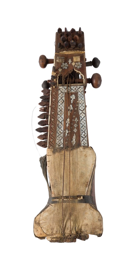 | SARANGI: SARANGI North India, Rajasthan, 20th century Carved dark wood, skin-covered resonator, pegs for main and sympathetic strings, bone and mother-of-pearl inlay. Length approx. 66 cm, width 22 cm. The