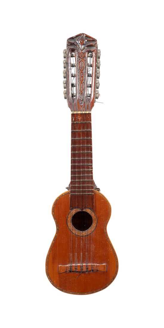 | CHARANGO: CHARANGO Andean region (Bolivia, Peru, or northern Argentina), mid-20th century. Painted wooden body, carved soundbox shaped like an armadillo, 10 bone tuning pegs, 10 strings, open pegbox with metal