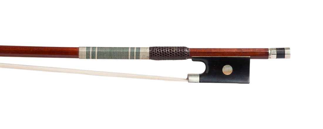 | VIOLINBOGEN 'F. LIEBICH BRESLAU': VIOLIN BOW 'F. LIEBICH BRESLAU' Breslau, early 20th century Round Pernambuco stick, single eye, silver mountings, thumb leather, winding, ivory frog. Length 74 cm, weight approx. 54 g. Violin bow