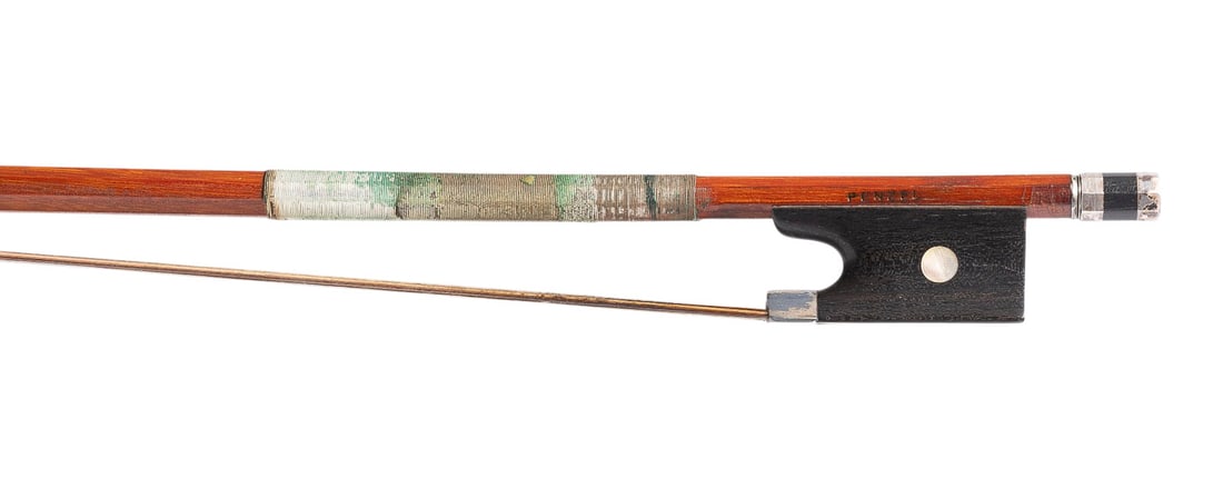 | VIOLINBOGEN 'PENZEL': VIOLIN BOW 'PENZEL' Markneukirchen, mid-20th century. Octagonal stick, simple eye, silver mounting, winding, ivory tip plate. Length 74.5 cm, weight approx. 52 g. Violin bow stamped 'Penzel', likely