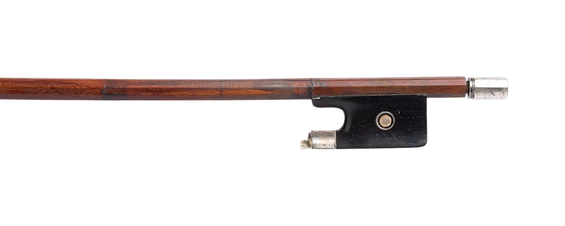 | VIOLINBOGEN (VERMUTLICH WERKSTATT OUCHARD): VIOLIN BOW (PROBABLY FROM THE OUCHARD WORKSHOP) France, mid-20th century Round stick, Parisian eye, ivory head plate. Length 74 cm, weight approx. 54 g. Marked ''A...'' on the underside of the stick, 