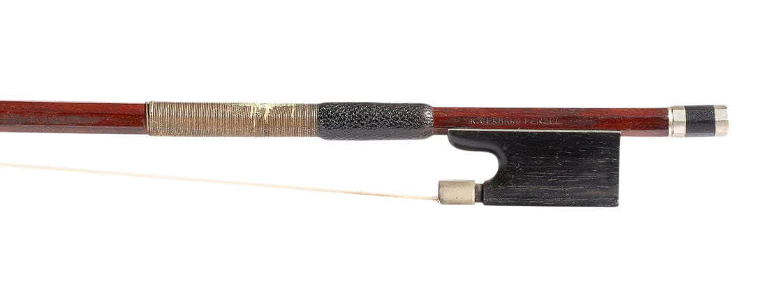 | VIOLINBOGEN 'KURT GERHARD PENZEL': VIOLIN BOW 'KURT GERHARD PENZEL' Stuttgart/Ostrach, mid-20th century. Octagonal stick, nickel-silver mountings, winding, thumb leather, ivory tip plate. Length 74.5 cm, weight approx. 54 g. Violin bow