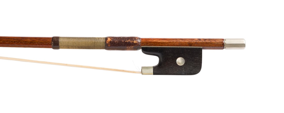| CELLOBOGEN: CELLO BOW 20th century. Octagonal stick, nickel silver mounting, winding, thumb leather, single eye, ivory head plate. Length 71.5 cm, weight approx. 82 g. Unmarked cello bow. Rubbed and bumped. CITES