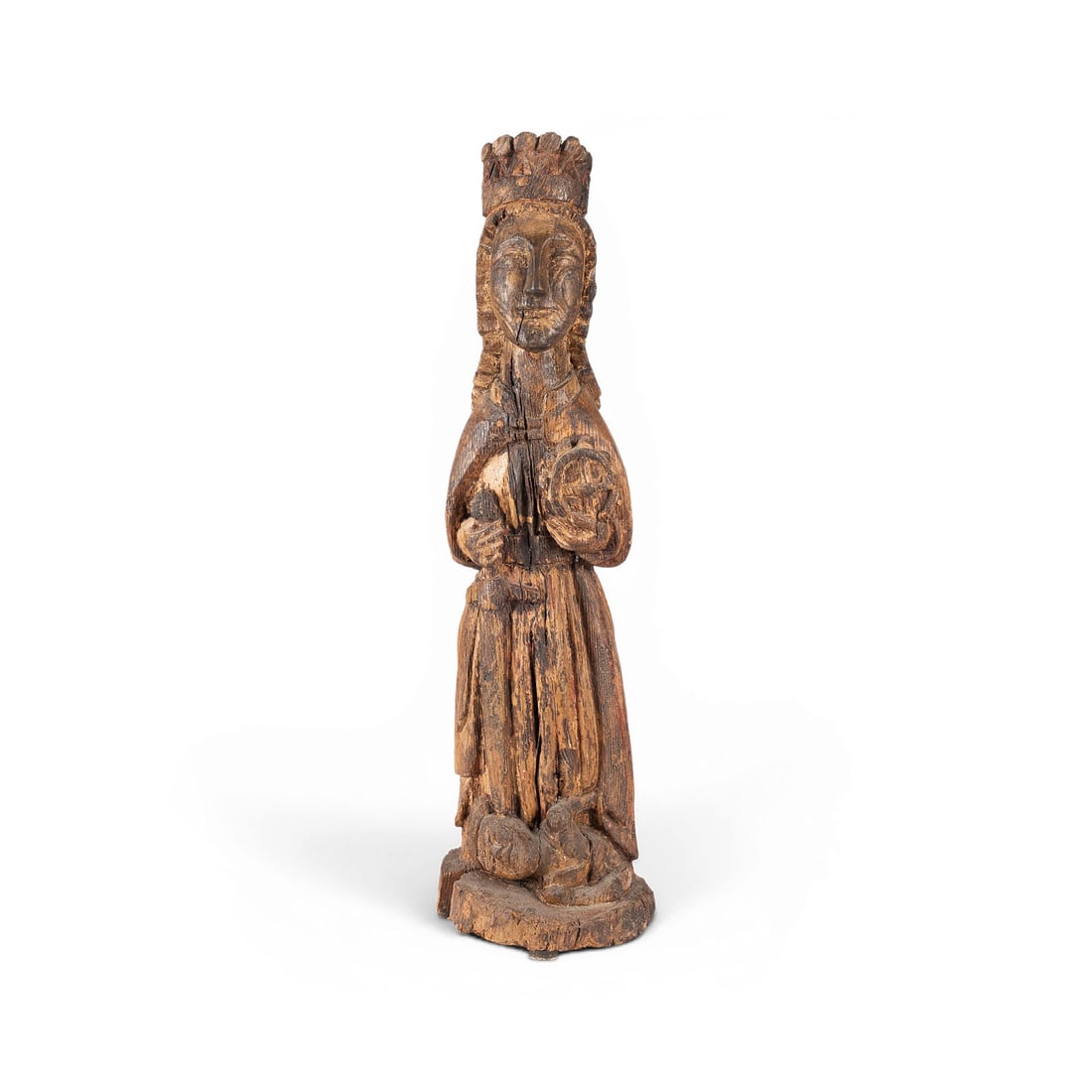 | HEILIGE KATHARINA: SAINT CATHERINE Asturias, likely 14th century Wood, carved in the round, polychrome finish, flattened at the back. H. 63, W. 17, D. 16 cm. Standing, crowned figure of Saint Catherine of Alexandria. In