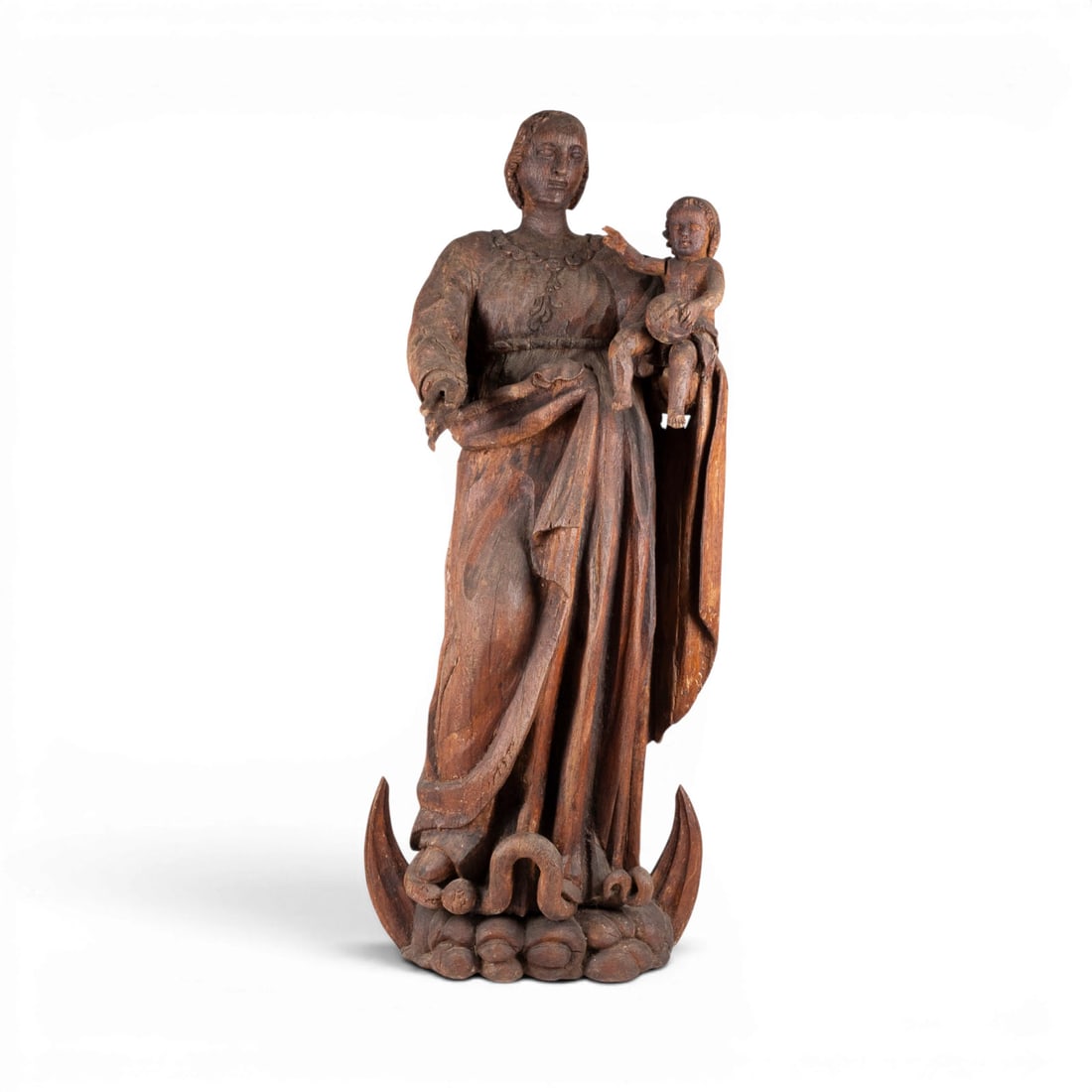 | GROSSE MONDSICHELMADONNA MIT CHRISTUSKIND: Large Madonna on the Crescent Moon with the Christ Child Flanders or Northern Germany, c. 1600 Oak, carved in the round, flattened at the back. H. 108, W. 42, D. 34 cm. Minor damage and abrasions; shr