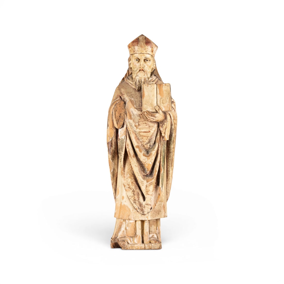| HEILIGER BISCHOFF ODER KIRCHENVATER MIT BUCH: SAINTED BISHOP OR CHURCH FATHER WITH A BOOK German, 17th century Wood, carved in the round, polychromed and gilded, flattened at the back. H. 67, W. 22, D. 16 cm. Standing figure of a sainted bishop i