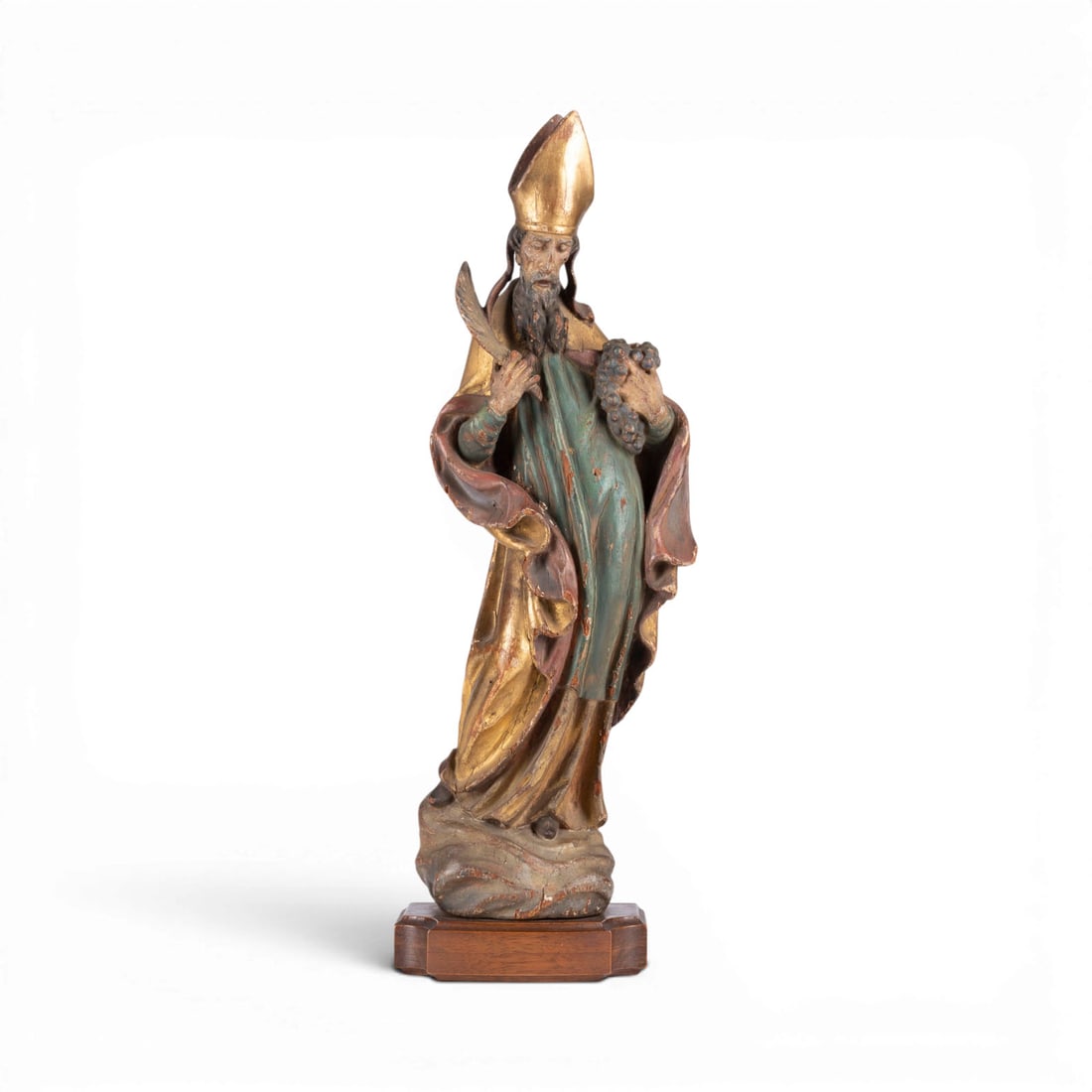 | HEILIGER URBAN: SAINT URBAN Southern Germany or Austria, 18th century Wood, carved in the round, polychromed and gilded, on a wooden base. H. 51, W. 16.5, D. 9.5 cm, weight approx. ... Figural depiction of Saint Urba