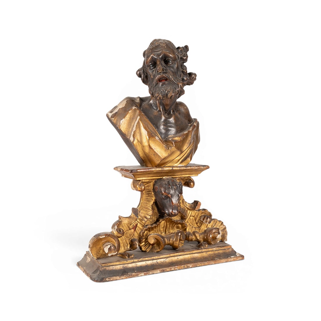 | BUeSTE DES EVANGELISTEN LUKAS AUF POSTAMENTSOCKEL: BUST OF SAINT LUKE THE EVANGELIST ON A PEDESTAL BASE Southern Germany or Austria, 18th century Wood; carved in the round, gilded, and polychromed. H. 54, W. 40, D. 15 cm. An expressive bust of the bea