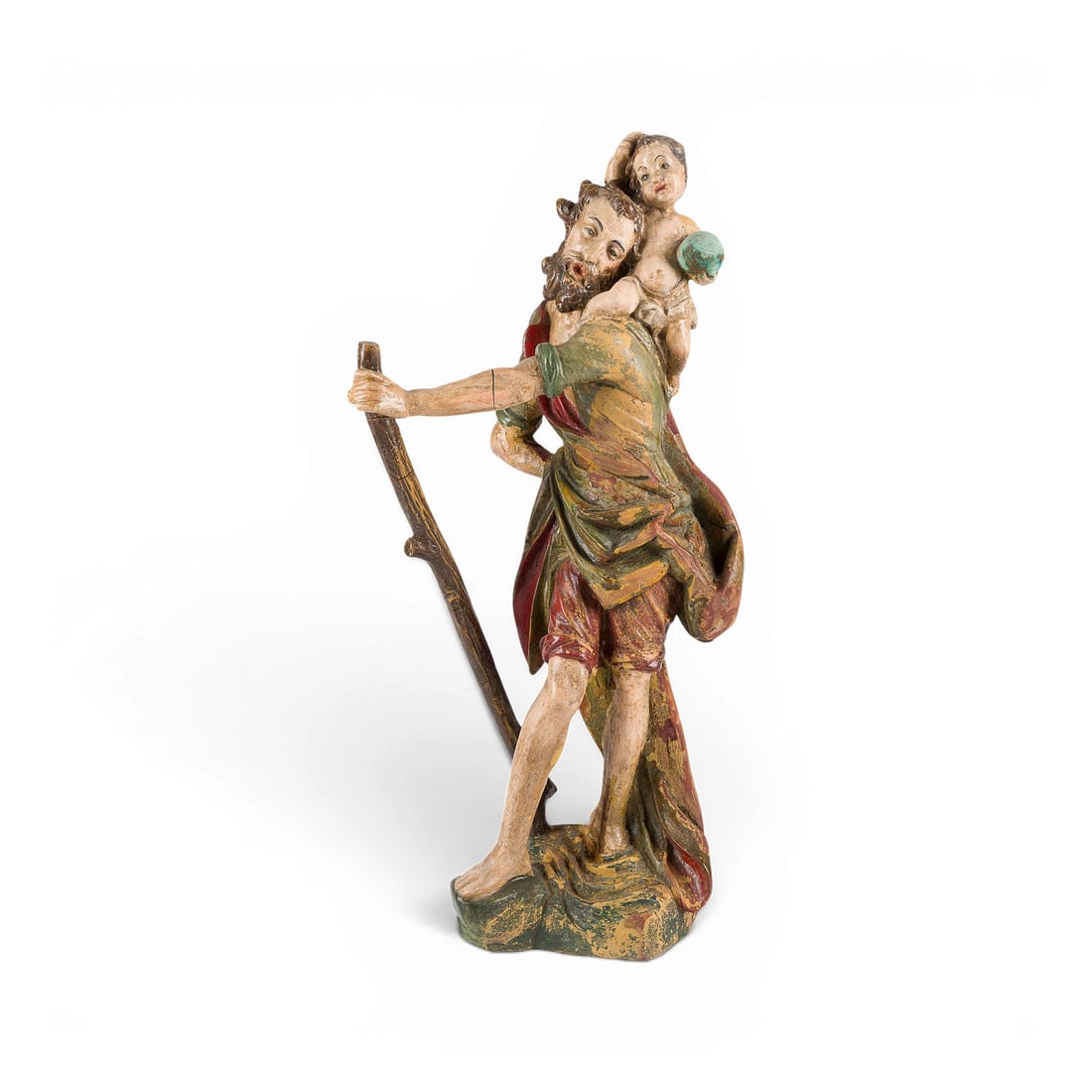 | HEILIGER CHRISTOPHERUS MIT CHRISTUKIND: SAINT CHRISTOPHER WITH THE CHRIST CHILD South German, 18th century Wood, carved in the round, polychrome finish, on a base. H. 51.5, W. 22, D. 19 cm; weight approx. 1.24 kg. A dynamic depiction of Sai