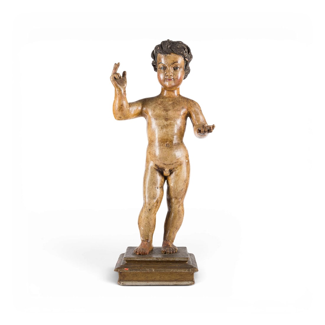 | SEGNENDES JESUSKIND (SALVATOR MUNDI): BLESSING INFANT JESUS (SALVATOR MUNDI) Likely South German, c. 1750 Wood, carved in the round, polychrome finish, on a square base. H. 71, W. 36, D. 25 cm. Standing figure of the unclothed Infant Jesu