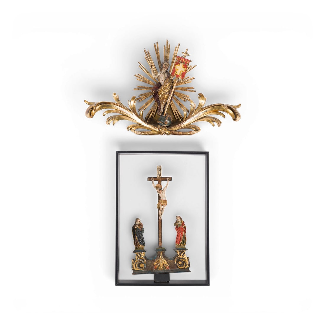 | ZWEI SAKRALE FIGUREN: KREUZIGUNGSGRUPPE UND AUFERSTANDENDER CHRISTUS: TWO SACRED FIGURES: CRUCIFIXION GROUP AND THE RISEN CHRIST South German, 18th century. Lindenwood, carved in the round, polychromed and gilded, flattened at the back; the Crucifixion group is framed b
