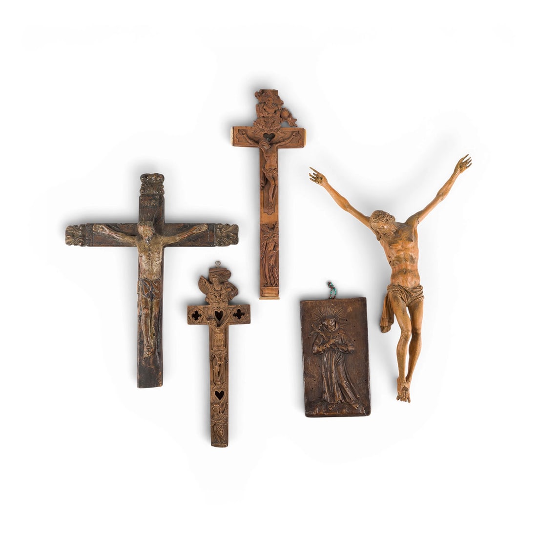 | KONVOLUT VON FUeNF SAKRALEN FIGUREN: GROUP OF FIVE SACRED FIGURES German, 18th/19th century Wood, carved in the round; heights 34/31/29/25/17 cm. Relief of Saint Francis of Assisi - inscribed on the back ''Hl. Franziskus'' (St. Francis) 