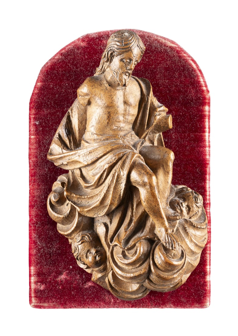 | CHRISTI HIMMELFAHRT: ASCENSION OF CHRIST Southern Germany/Austria, circa 1700 Walnut, sculpted, on velvet-covered wooden base (14 x 9.5 cm). Figure H. 13, W. 8.5, D. 4 cm, weight approx. 122g. Relief depiction of Christ f
