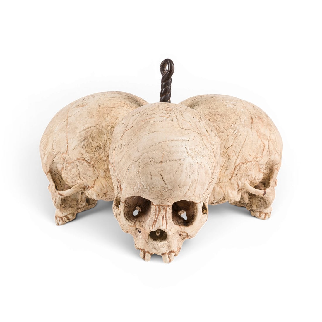 | MEMENTO MORI 'DREI TOTENSCHAeDEL': MEMENTO MORI 'THREE SKULLS' Germany or Austria, 19th century Wood, carved in the round, polychrome finish, metal suspension mount. H. 12, W. 18, D. 19 cm; weight approx. 0.38 kg. An expressive memento