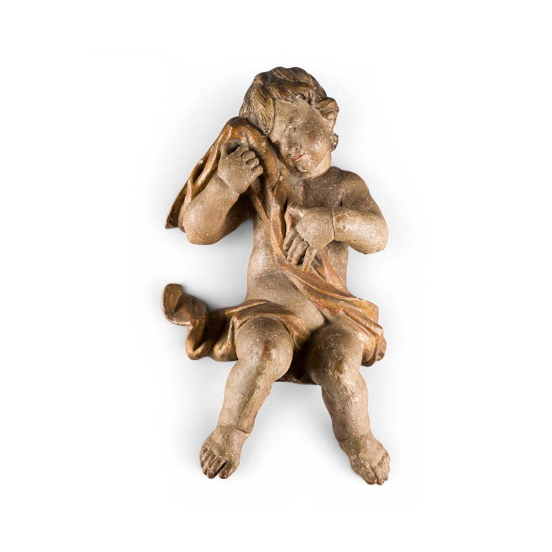 | SITZENDER PUTTO: SITTING PUTTO Southern Germany, 18th century Oak, sculpted, gilded, polychrome, primed, flattened on the back. H. 55, W. 31, D. 22 cm, weight approx. 4.45 kg. Partially bumped, loss of material, damag