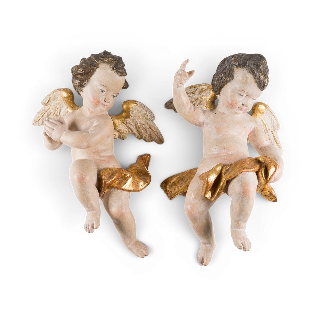 | PAAR SCHWEBENDE GEFLUeGELTE PUTTENFIGUREN: PAIR OF FLOATING WINGED PUTTI South German, 18th century Wood, carved in the round, polychrome painted and gilded. H. 60/61 cm each, W. 45/44 cm, D. 19/20 cm. Part. damage, losses to the finish,