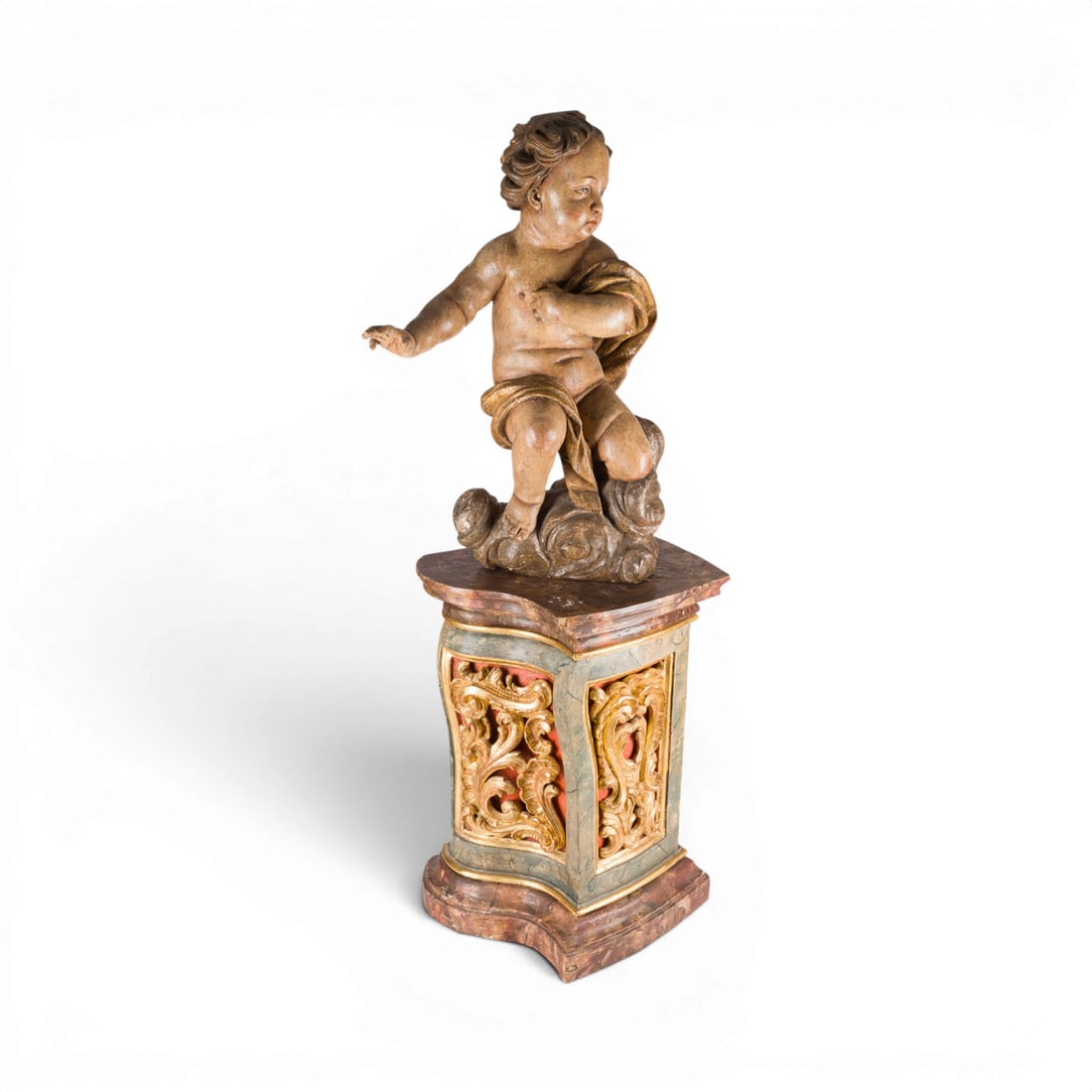 | GROSSER SCHWEBENDER PUTTO MIT KONSOLE: LARGE FLOATING PUTTO WITH CONSOLE Germany or Austria, c. 1720 Limewood, carved in the round, polychrome-painted and gilded, on a console table. Total height 139 cm, width 50 cm, depth 48 cm.