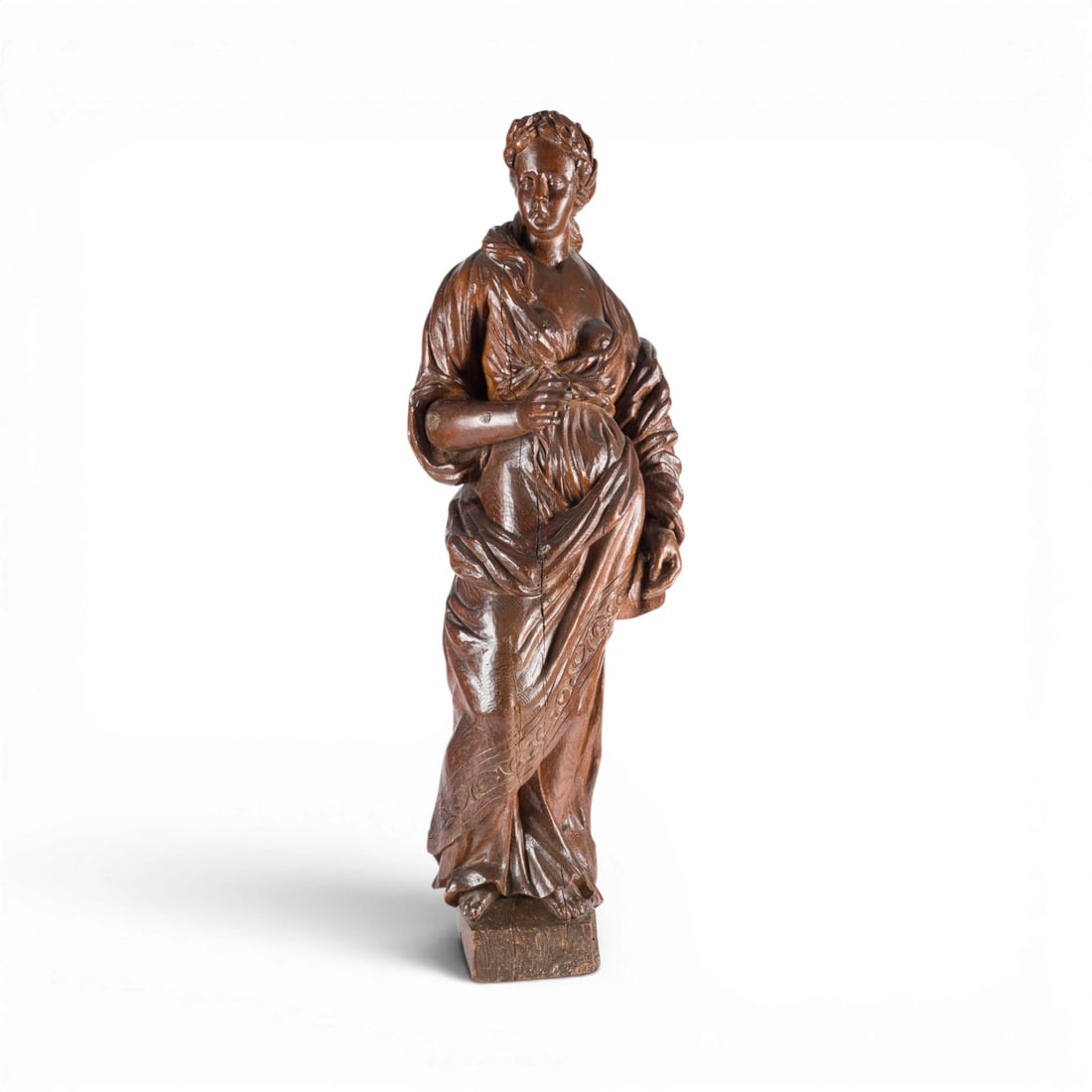 | ALLEGORISCHE FRAUENFIGUR (WOHL ALLEGORIE DER FRUCHTBARKEIT): ALLEGORICAL FEMALE FIGURE (LIKELY AN ALLEGORY OF FERTILITY) Italy or Southern Germany, late 18th century. Walnut, carved in the round. H. 101, W. 38, D. 28 cm. Large Baroque wood sculpture of a female
