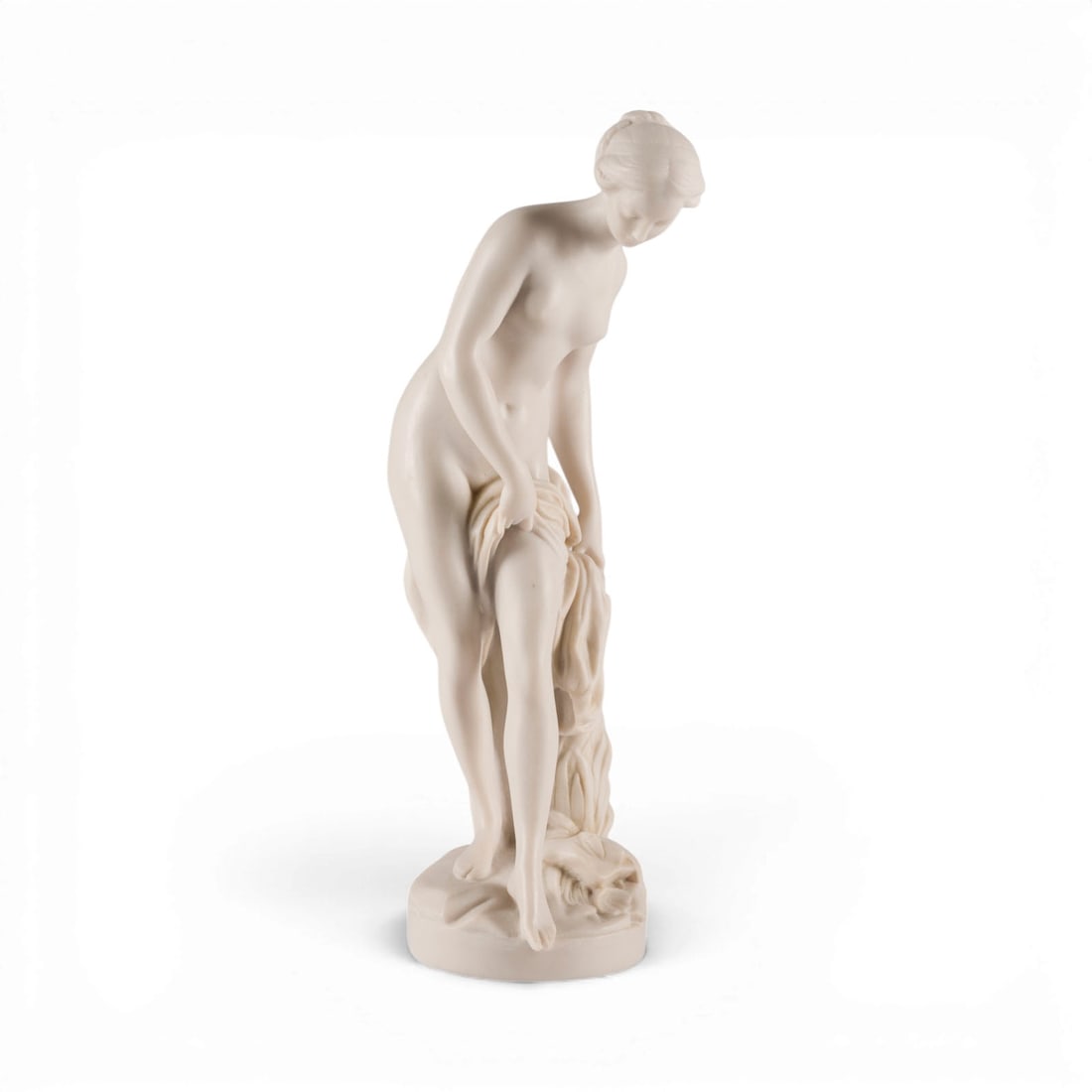 UNBEKANNTER BILDPLASTIKER | 'VENUS NACH DEM BADE': UNKNOWN SCULPTOR Active 20th century 'VENUS AFTER THE BATH' Cast marble. H. 33.5, W. 10.5, D. 12.5 cm, weight approx. 1.7 kg. Nude figure of a standing woman holding a cloth over her thigh, following 
