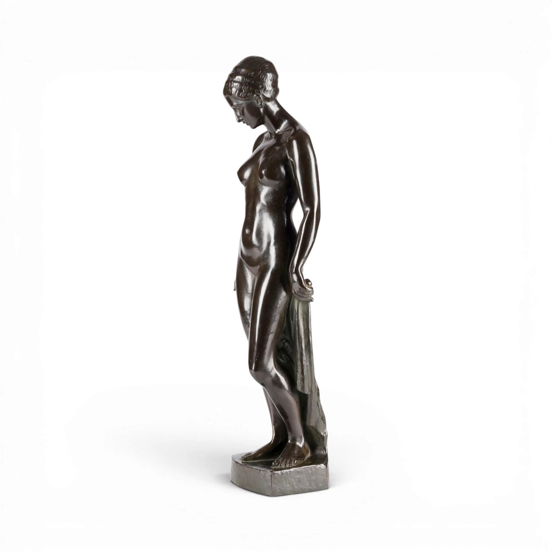 RUDOLF STOCKER | STEHENDER FRAUENAKT: RUDOLF STOCKER 1879 Stuttgart - before 1938 Stuttgart STANDING FEMALE NUDE Bronze, dark patina, on a plinth. H. 59, W. 18, D. 12.5 cm; weight approx. 5.48 kg. Inscribed 'Rud. Stocker' on the plinth. P