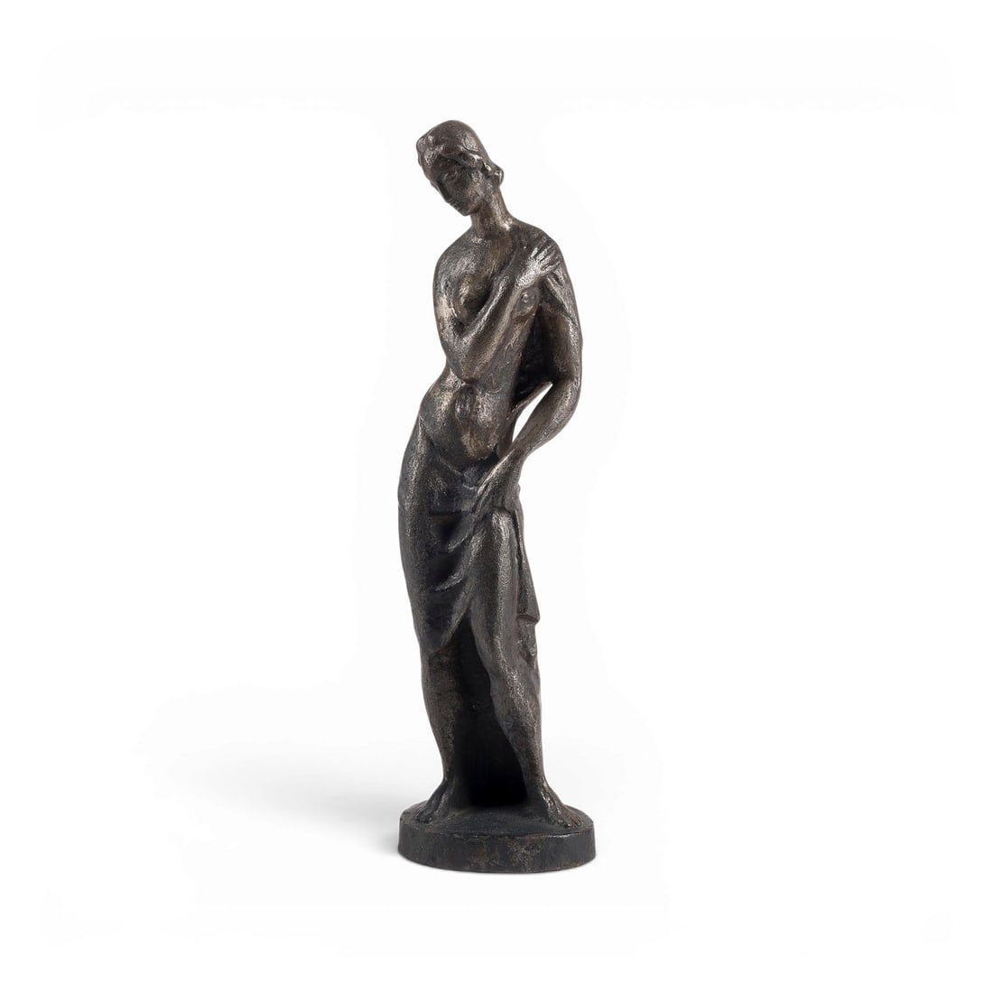 JACOB WILHELM FEHRLE | STEHENDER FRAUENAKT: JACOB WILHELM FEHRLE 1884 Schwaebisch Gmuend - 1974 ibid. STANDING FEMALE NUDE Cast iron, dark patina. H. 27.5, W. 7.5, D. 6.5 cm. Monogrammed 'JWF' on the back of the plinth. With minor damage and re