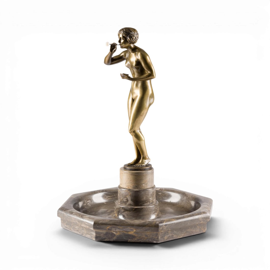 C. A. SOeDING | 'SEIFENBLASENBLAeSERIN': C. A. SOeDING 1858-1934 'GIRL BLOWING SOAP BUBBLES' Bronze with gold patina, set on a round plinth within a hexagonal marble bowl designed like a table fountain. Figure height 33 cm, total height 47 c