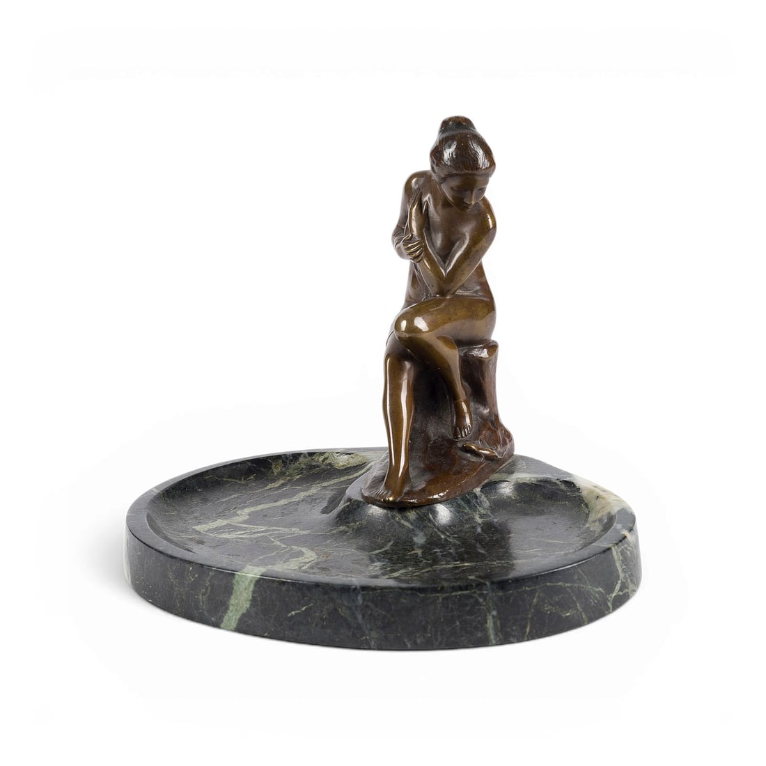 RUDOLF KAESBACH | FRAUENAKT MIT ECHSE ALS ZIERSCHALE: RUDOLF KAESBACH 1873 Moenchengladbach - 1955 Berlin FEMALE NUDE WITH LIZARD AS A DECORATIVE DISH Bronze, brown patina, mounted on an oval stone dish. H. 16, W. 18.5, D. 14.5 cm; weight approx. 1.83 kg